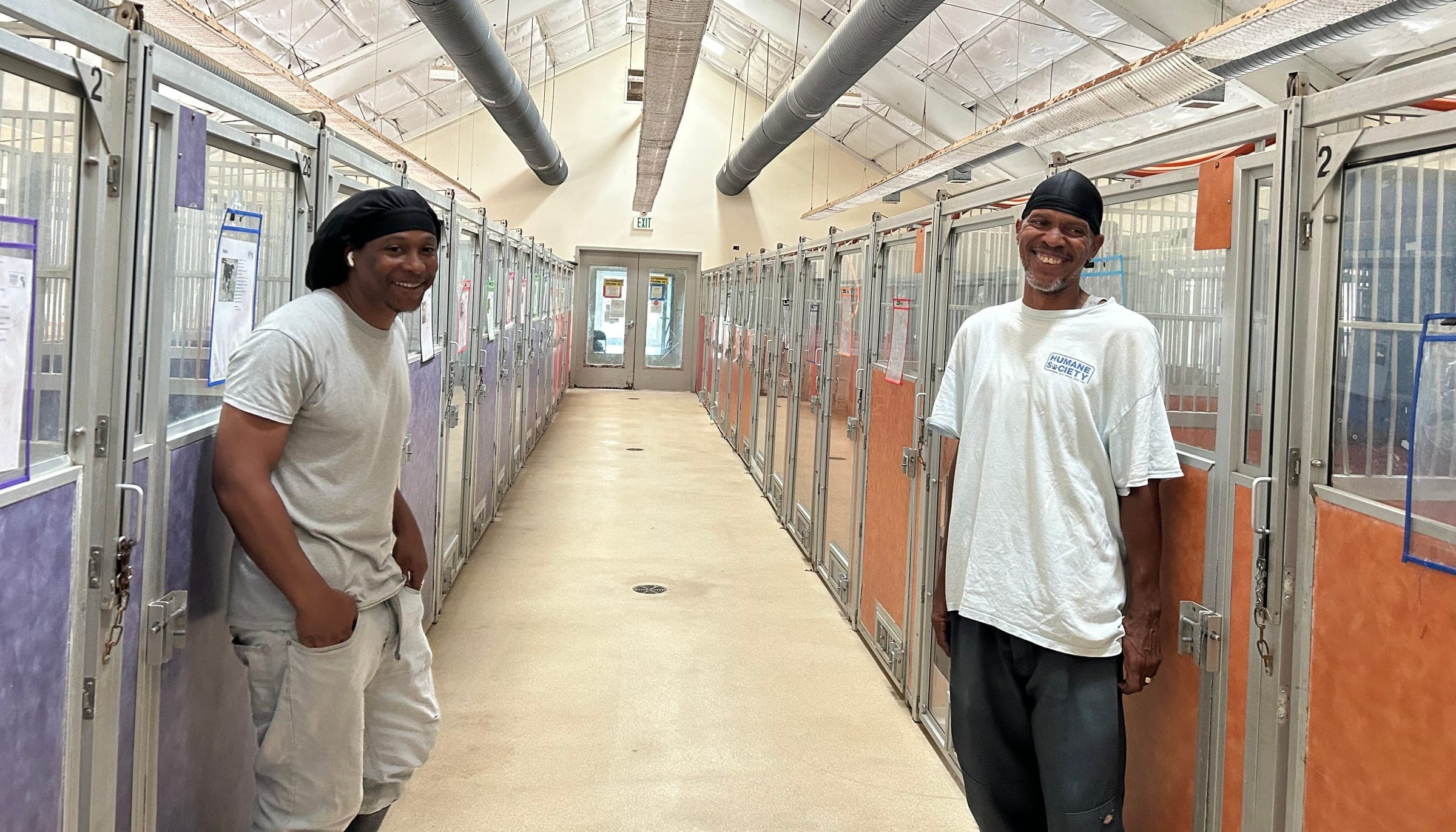 HSSTT staff members in the shelter kennel corridor