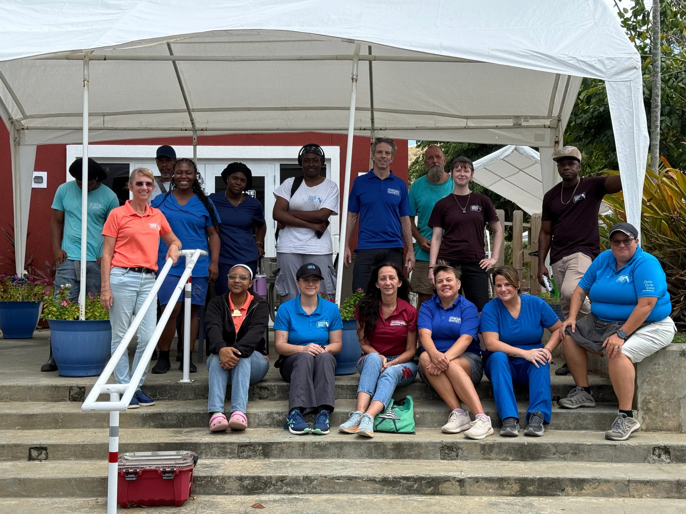 The Humane Society of St. Thomas staff gathered on the shelter steps